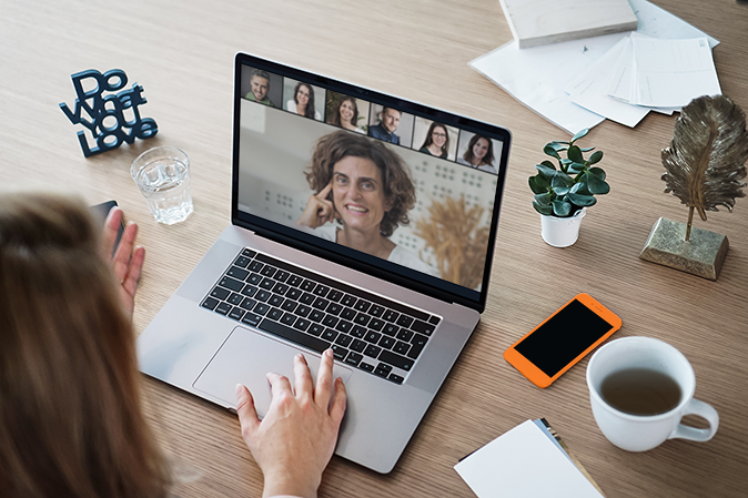 Woman interacting with group on Zoom meeting
