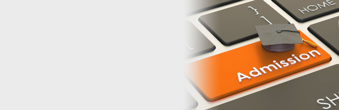 Image of a computer keyboard with an orange “Admission” key and a graduation cap.